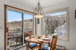 Enjoy breathtaking mountain views from this charming dining area.