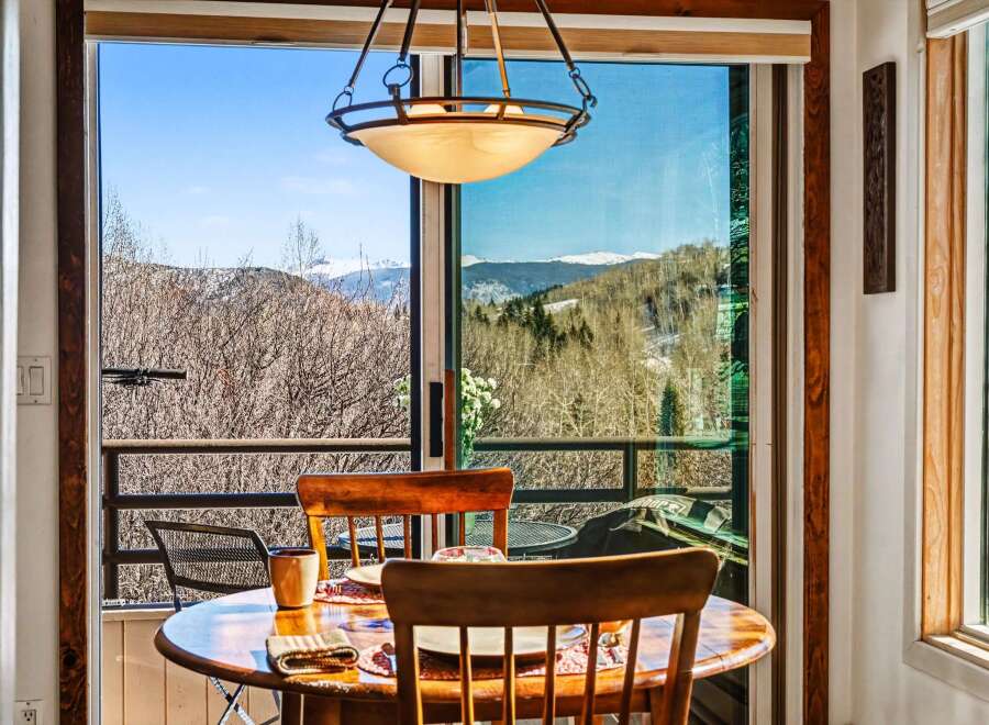 Enjoy breathtaking mountain views from this charming dining area.