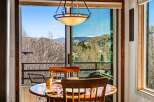 Enjoy breathtaking mountain views from this charming dining area.