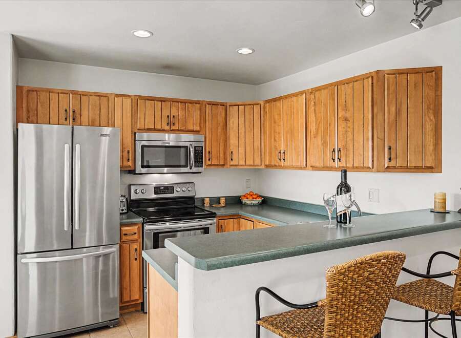 This stunning kitchen boasts modern appliances and ample counter space, perfect for culinary enthusiasts.