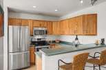 This stunning kitchen boasts modern appliances and ample counter space, perfect for culinary enthusiasts.