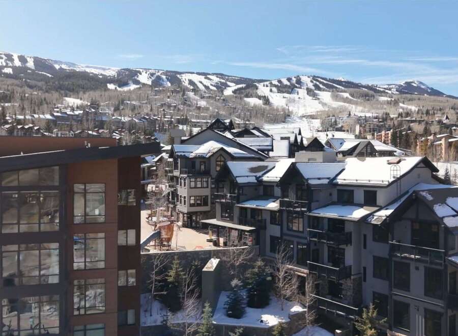 Discover luxury living in this stunning mountain property, boasting breathtaking views of snow-capped peaks and a charming village setting.