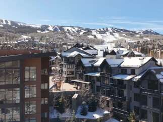 Discover luxury living in this stunning mountain property, boasting breathtaking views of snow-capped peaks and a charming village setting.