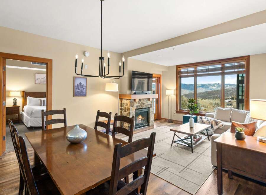 This stunning property boasts a cozy living space with a fireplace, perfect for relaxing evenings.
