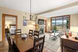 This stunning property boasts a cozy living space with a fireplace, perfect for relaxing evenings.