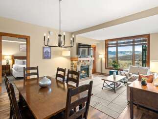 This stunning property boasts a cozy living space with a fireplace, perfect for relaxing evenings.