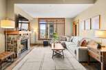 Experience luxury living in this stunning property featuring a cozy fireplace and a spacious, modern living area.
