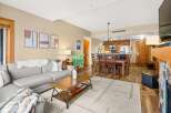 This stunning property boasts a spacious living area with a cozy fireplace, perfect for relaxing evenings.