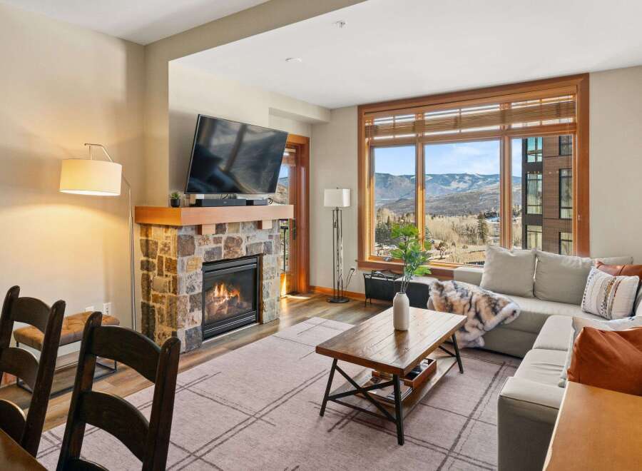 Experience luxury living in this stunning property featuring a cozy fireplace, perfect for chilly evenings.