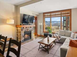 Experience luxury living in this stunning property featuring a cozy fireplace, perfect for chilly evenings.