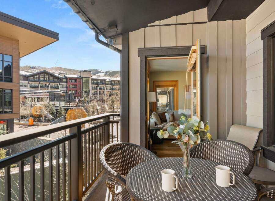 Enjoy breathtaking views from this stunning balcony! This property features a cozy outdoor seating area, perfect for morning coffee or evening relaxation.