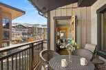 Enjoy breathtaking views from this stunning balcony! This property features a cozy outdoor seating area, perfect for morning coffee or evening relaxation.