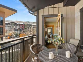 Enjoy breathtaking views from this stunning balcony! This property features a cozy outdoor seating area, perfect for morning coffee or evening relaxation.