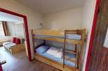 This cozy room features a bunk bed, perfect for accommodating guests or family members.