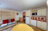 Discover this cozy apartment featuring a well-equipped kitchen with modern appliances.