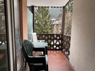 Enjoy the serene views from this charming balcony.