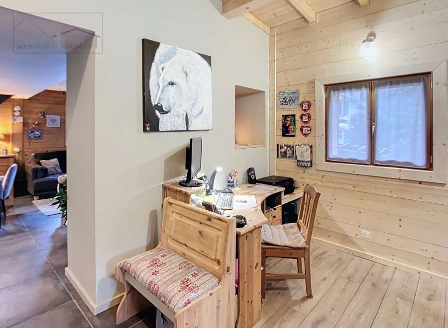 This charming property features a cozy workspace with a desk and bench, perfect for remote work or creative projects.