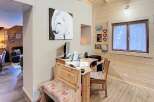 This charming property features a cozy workspace with a desk and bench, perfect for remote work or creative projects.