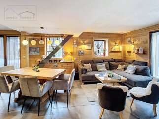 Step into this cozy chalet-style living space, perfect for relaxation and entertaining.