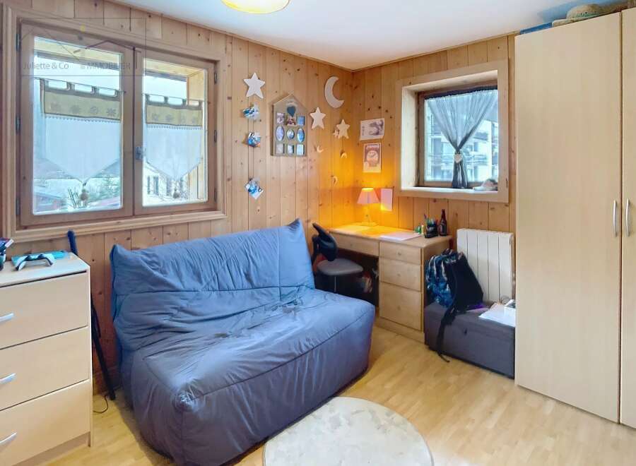 Discover this charming room featuring a cozy sofa, perfect for relaxation.