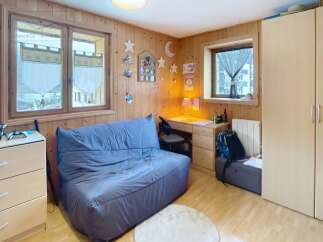 Discover this charming room featuring a cozy sofa, perfect for relaxation.