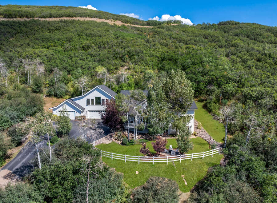 Nestled amidst lush greenery, this stunning property offers a serene escape with its spacious layout and modern design.