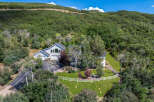 Nestled amidst lush greenery, this stunning property offers a serene escape with its spacious layout and modern design.