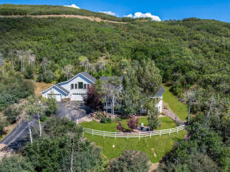 Nestled amidst lush greenery, this stunning property offers a serene escape with its spacious layout and modern design.