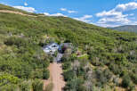 Nestled in a serene, wooded landscape, this stunning property offers unparalleled privacy and natural beauty.