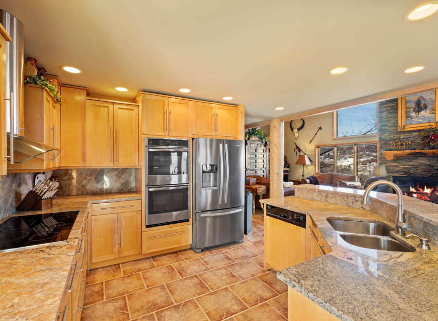 This stunning kitchen boasts a modern design with stainless steel appliances and custom cabinetry.