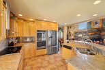 This stunning kitchen boasts a modern design with stainless steel appliances and custom cabinetry.