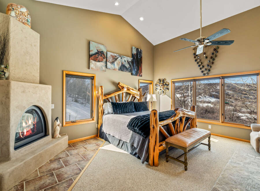 This stunning bedroom boasts a rustic, yet elegant design, perfect for a luxurious retreat.