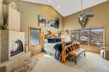 This stunning bedroom boasts a rustic, yet elegant design, perfect for a luxurious retreat.