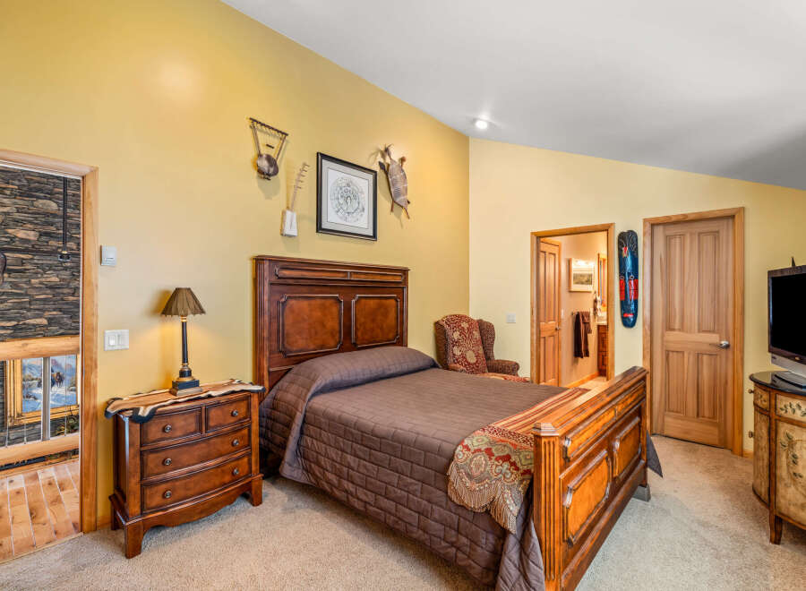 This stunning bedroom boasts a warm and inviting atmosphere, perfect for relaxation.