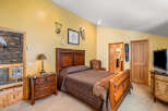 This stunning bedroom boasts a warm and inviting atmosphere, perfect for relaxation.