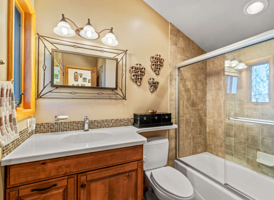 This stunning bathroom boasts a unique design with a touch of artistic flair.