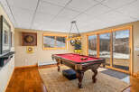This stunning property features a game room with a pool table, perfect for entertaining guests.