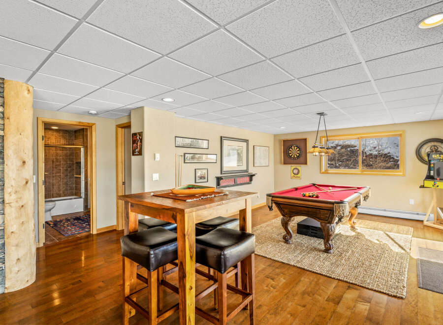 This stunning property boasts a spacious game room, perfect for entertaining and relaxation.