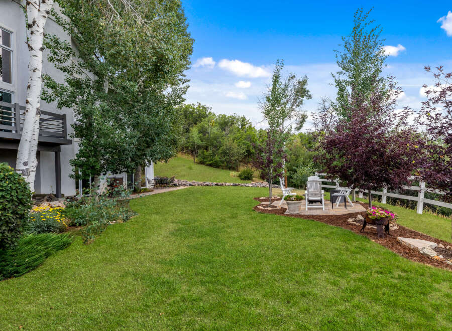 This stunning property boasts a beautifully landscaped backyard, perfect for outdoor entertaining.