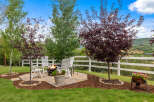 Enjoy outdoor living at its finest with this stunning property! Featuring a cozy patio with a fire pit, perfect for entertaining or relaxing.