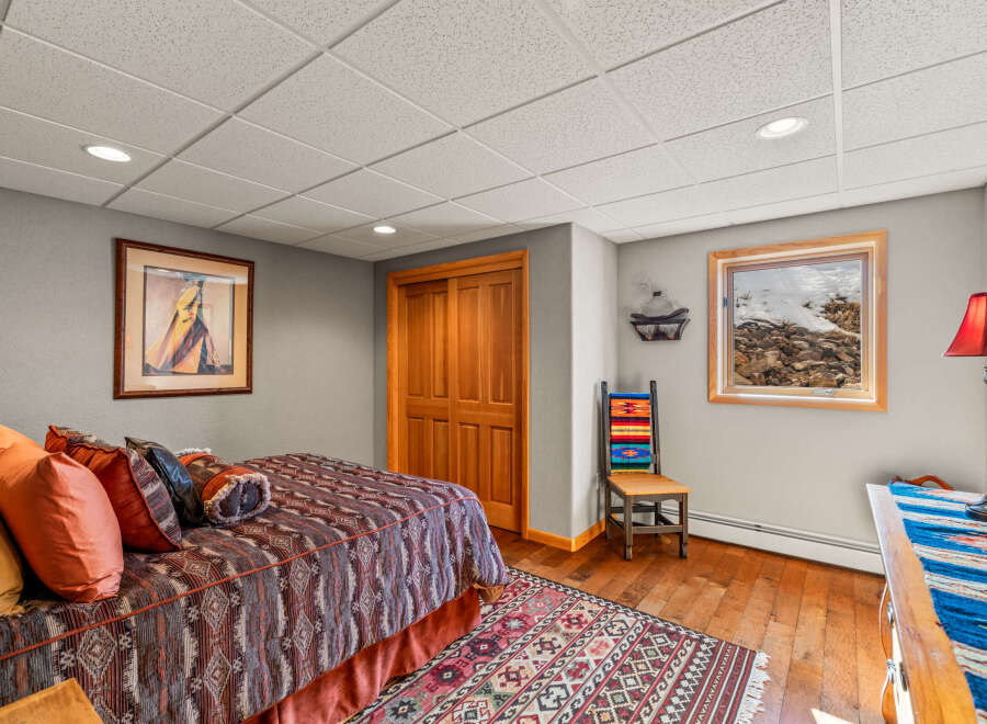 This cozy bedroom features a warm and inviting atmosphere, perfect for relaxation.