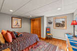 This cozy bedroom features a warm and inviting atmosphere, perfect for relaxation.