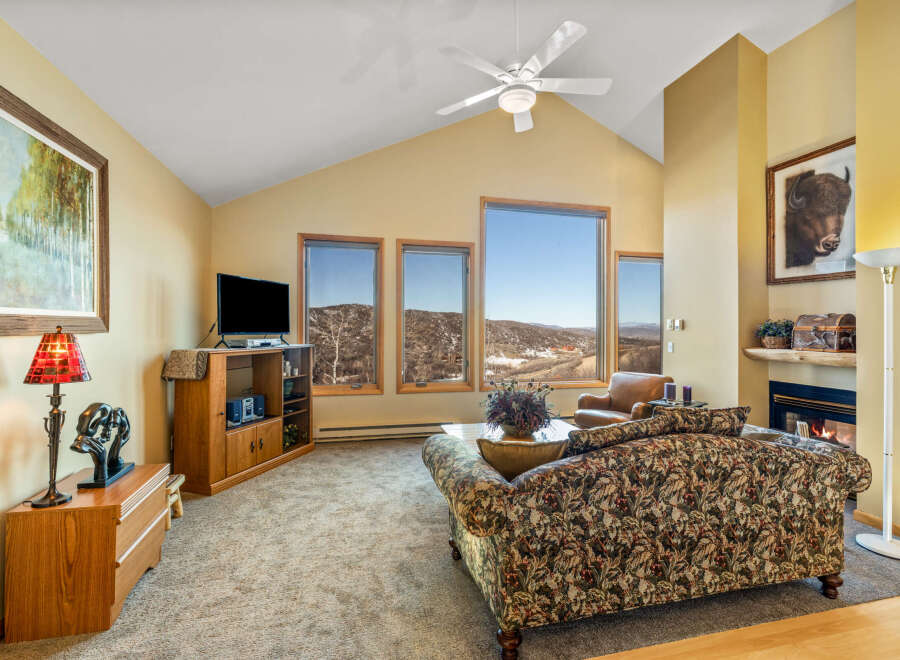 This stunning living room boasts a cozy fireplace, perfect for chilly evenings.