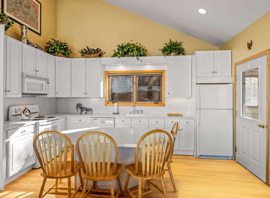 This charming kitchen boasts a bright and airy atmosphere, perfect for culinary adventures.