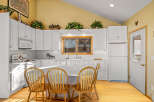 This charming kitchen boasts a bright and airy atmosphere, perfect for culinary adventures.