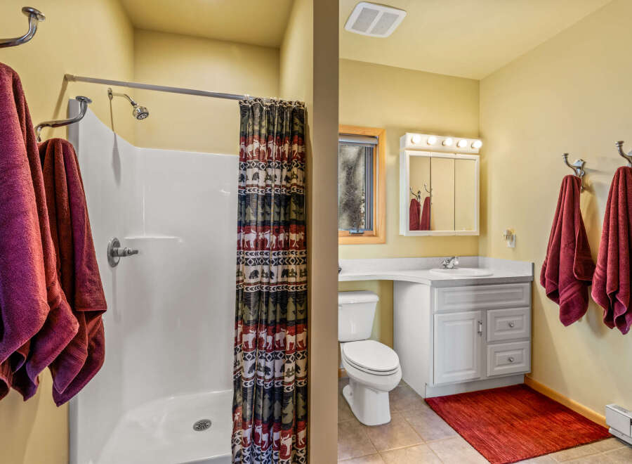 This charming bathroom features a clean and modern design, perfect for a relaxing retreat.