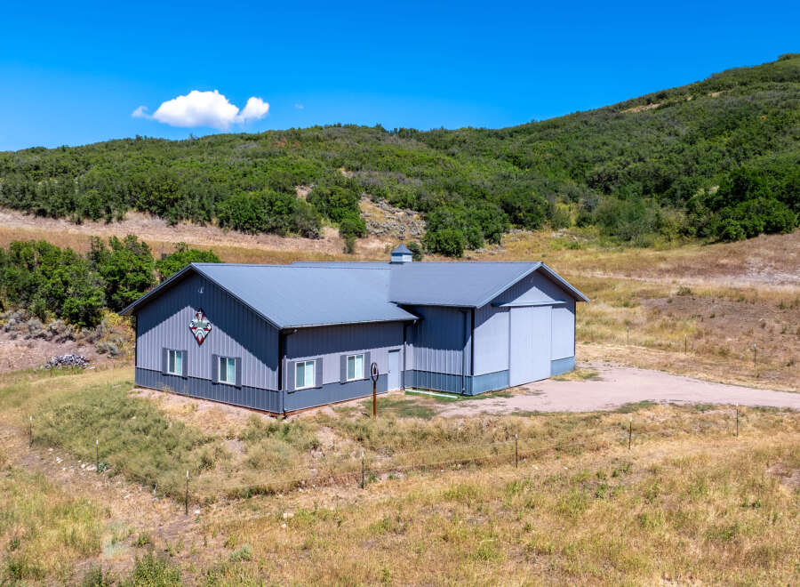 This stunning property boasts a spacious, modern barn-style building with ample room for various uses.