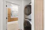Step into modern luxury with this stunning property, featuring a beautifully designed laundry area.