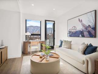 Experience luxury living in this stunning property, featuring a bright and airy living space with breathtaking mountain views.