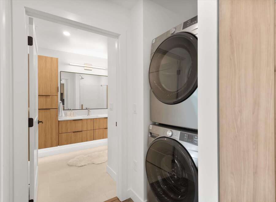 Step into modern luxury with this stunning property, featuring a beautifully designed laundry area.